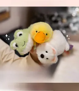 Close-up of soft plush animal fridge magnets including frog, duck and white bear toys