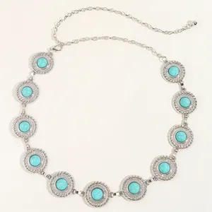 Close-up of vintage silver chain belt featuring round turquoise stone inlays and lobster clasp