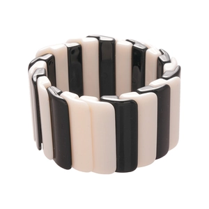 Elastic wide bracelet with geometric black and white acrylic stripes in a modern design