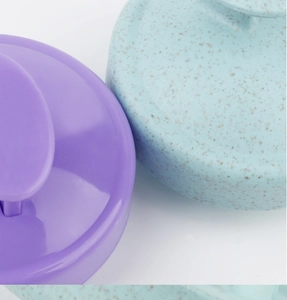 Detail of 19-tooth scalp massager brush in purple plastic and blue wheat straw finish