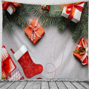 Detail of Christmas wall tapestry featuring festive red stockings and gift box patterns