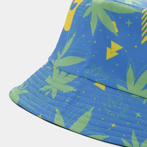 Reversible bucket hat with navy base and neon green leaf print for sun protection