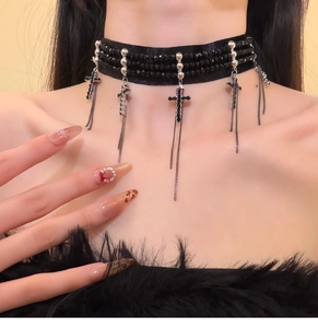 Detail of gothic choker with black beads, silver cross pendants and fringe chain tassels