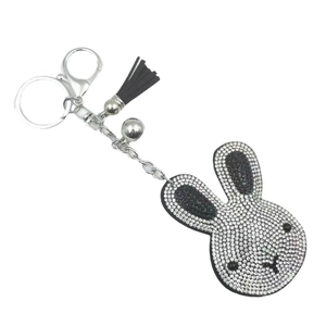 Sparkling rhinestone rabbit keychain with black tassel and bell in silver finish
