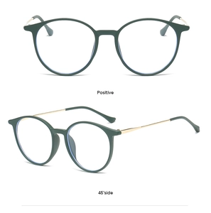 Front and side views of dark green round glasses with vintage gold metal temples