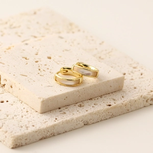 Detail of S925 sterling silver gold earrings with rectangular white mother of pearl inlay
