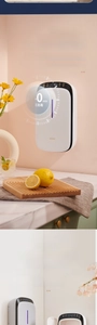 Detail of smart wall-mounted kitchen sterilizer with LED display and 90-degree sensor lid