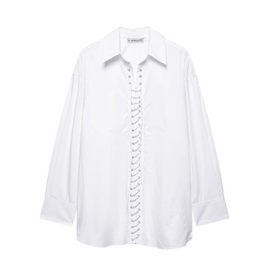 Women's white V-neck long sleeve shirt featuring irregular hem and eyelet lace-up front