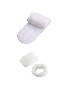 Detailed view of white absorbent spa headband with velcro and matching wrist washbands