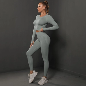 Detail view of seamless scrunch leggings and long sleeve crop top in sage green color