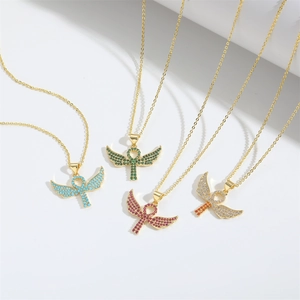 Gold Ankh cross necklace with angel wings pendant and colorful zircon stones on white background