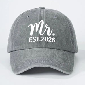 Washed dark grey baseball cap featuring a white Mr. EST. 2026 print on vintage denim