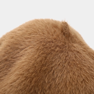 Detailed texture of warm brown faux mink fur beret featuring premium stitching detail