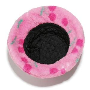 Detail of pink plush bucket hat with cherry print and warm black quilted lining interior