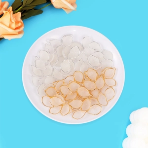 Macro view of translucent lotus petals with gold and silver edges for DIY jewelry