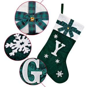 Large dark green velvet Christmas stocking with white knit cuff and letter embroidery