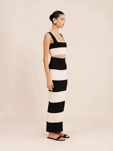 Women's chic black and white striped knitted two-piece set with crop top and maxi skirt
