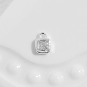 Detailed macro view of S925 silver square pendant with clear cubic zirconia crystal