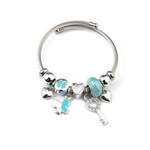 Detail of silver beaded bracelet with heart charms and a key pendant on twisted wire band