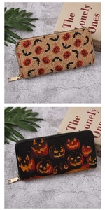 Detail of Halloween long wallets with pumpkin patterns and eco-friendly cork texture