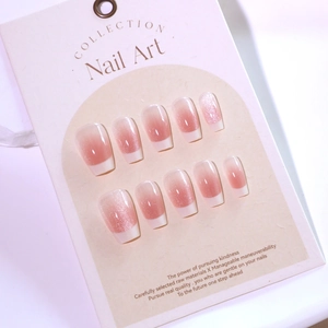 Pink gradient cat eye press-on nails with white French tips and glitter in short ballet style