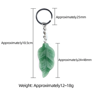 Green leaf crystal agate keychain with silver metal chain on a white background