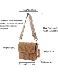 Brown handmade woven straw crossbody bag with geometric strap and tassel details