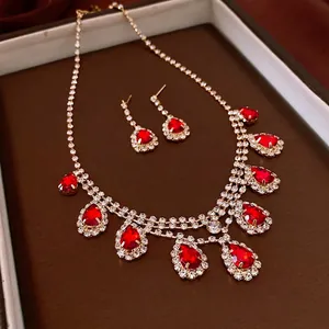 Luxury water drop tassel necklace and earrings set with red stones and gold plating