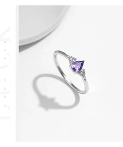 Detail of s925 silver ring featuring a pear-cut purple amethyst and side diamonds