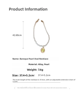 Detail showing the length of vintage tulip baroque pearl necklace with oval green stone