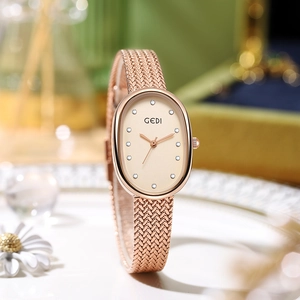 Elegant rose gold oval watch with mother of pearl dial and sparkling rhinestone markers