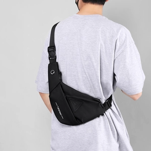 Detail of black waterproof chest bag with geometric triangle pattern and headphone port