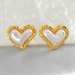 French vintage heart shaped earrings with gold textured metal and white pearl center