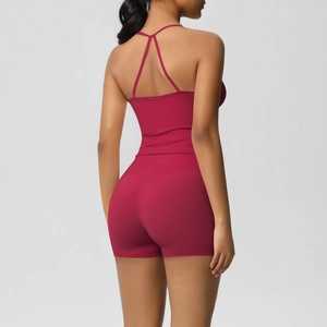 Detailed back view of dark rose yoga top with criss-cross straps and high-waist shorts