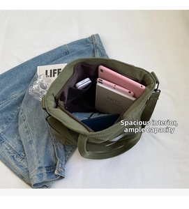 Internal view of green corduroy tote bag showing spacious lining and pockets