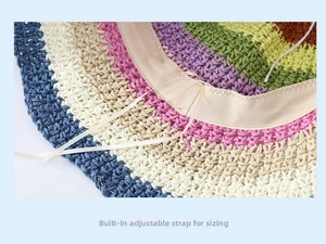 Detail of rainbow straw hat featuring an adjustable inner sweatband and white drawstring