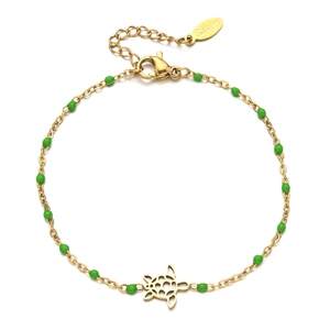 Gold stainless steel turtle charm bracelet with green beads on a clean white background