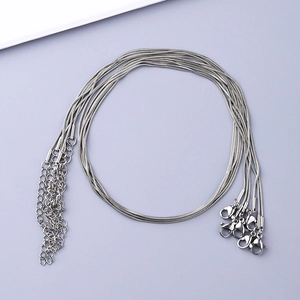 Macro shot of silver stainless steel snake bone chains with lobster clasps and extenders