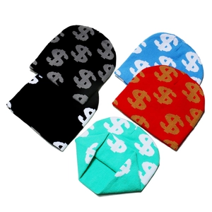 Flat lay detail showing knit beanies in black, blue, red, and mint with dollar patterns