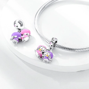 Macro detail of S925 silver Gemini constellation charm with purple enamel on snake chain