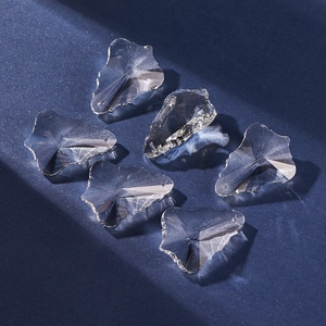 Macro shot of six faceted clear crystal glass pendants with refractive light effects