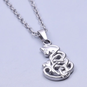 Macro view of silver cat pendant with Celtic knot pattern on stainless steel necklace