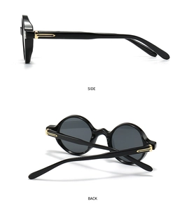 Vue détaillée des lunettes de soleil rétro à monture noire et charnières métalliques dorées