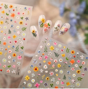 Close-up of aesthetic spring floral nail stickers featuring Monet garden designs