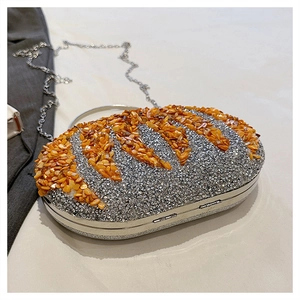 Detail of silver rhinestone evening bag with orange amber accents and detachable chain