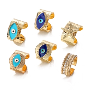 Retro golden Evil Eye ring set with starfish detail and turquoise enamel finish