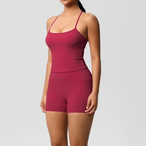 Detail view of deep rose yoga set featuring spaghetti strap top and high-waist side pocket shorts