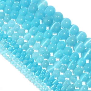 Detailed macro view of blue cat-eye stone loose beads for DIY jewelry making material