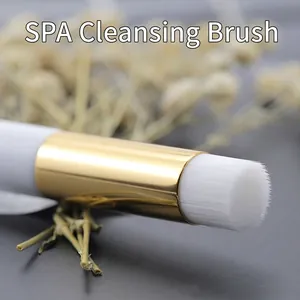 Portable SPA nose cleaning brush with soft white bristles and high-shine gold ferrule