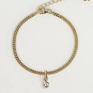 Minimalist gold chain bracelet featuring a round white zircon pendant and lobster clasp